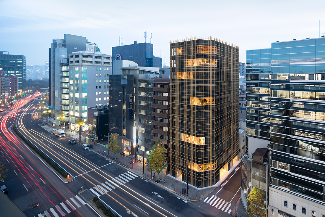 Nendo Creates A Pierced Office Building With Large Garden Terraces